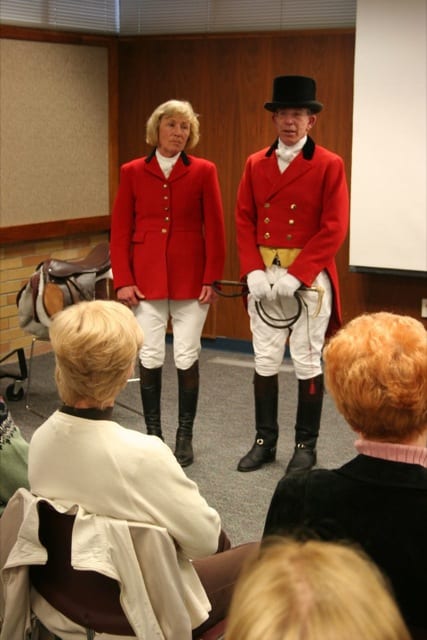 HUNT CLUB MEMBERS IN FULL DRESS - Jean Brooks and Mike Wager show off the customary outfits worn by participants in a fox hunt at the Woodbrook Hunt Club. They explained the parts of their outfits before author Joy Keniston-Longrie spoke about the club before members of the Lakewood Historical Society.