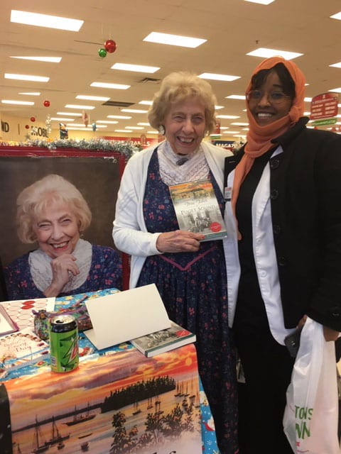 Dorothy Wilhelm hosts Swimming Upstream. Here she is last Tuesday at a Booksigning at University Place Bartells.  Books are completely sold out until Friday.